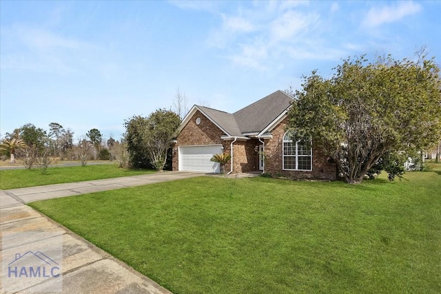 view of front of house featuring a front yard, brick siding, driveway, and an attached garage