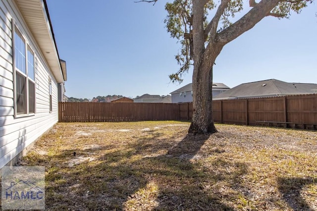 view of yard with a fenced backyard