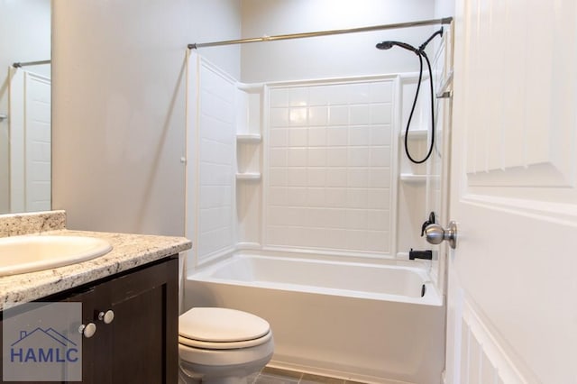 bathroom featuring toilet, shower / washtub combination, and vanity