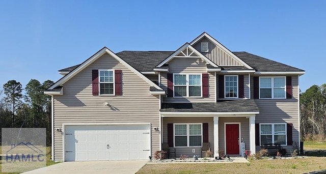 craftsman-style home featuring an attached garage, board and batten siding, and driveway