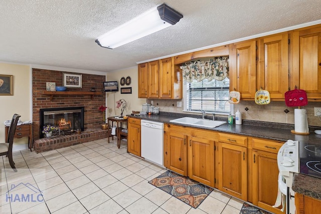 kitchen featuring range with electric cooktop, sink, white dishwasher, a brick fireplace, and a textured ceiling