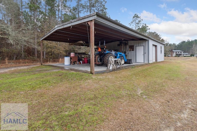 exterior space with a garage and a lawn