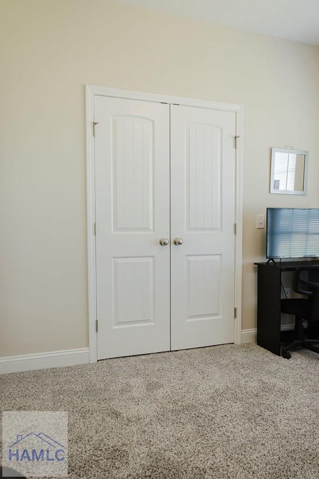 bedroom with carpet floors and a closet