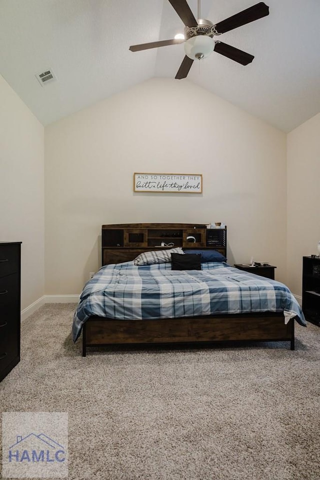 carpeted bedroom with ceiling fan and vaulted ceiling