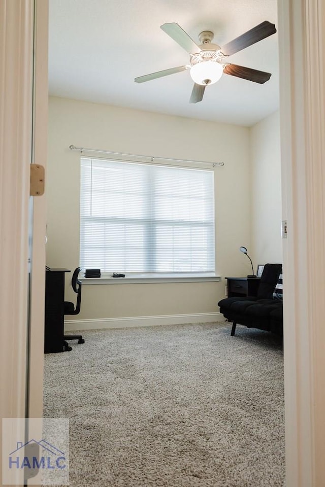 sitting room featuring carpet flooring and ceiling fan