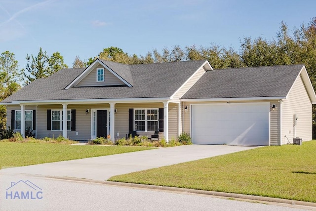 view of front of home with a front lawn and a garage