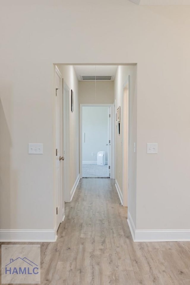 hall with light wood-type flooring