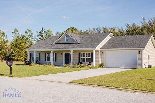 view of front of property featuring a garage and a front lawn