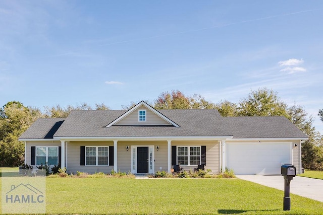 view of front of home with a garage and a front yard