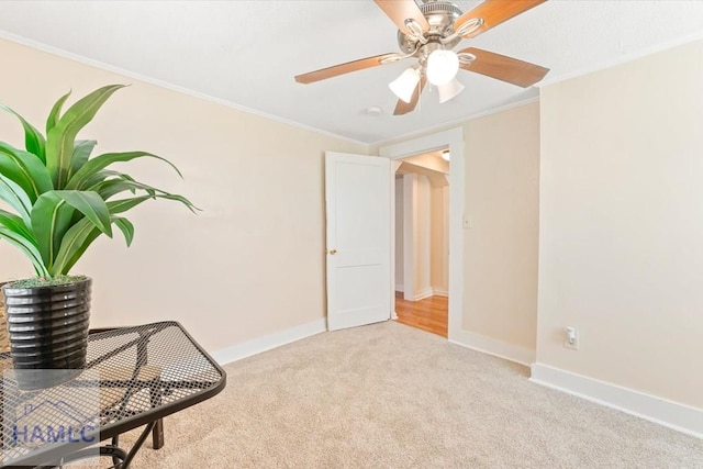 1514 Augusta Ave, Savannah, GA 31415 - unfurnished room featuring crown molding, baseboards, a ceiling fan, and carpet