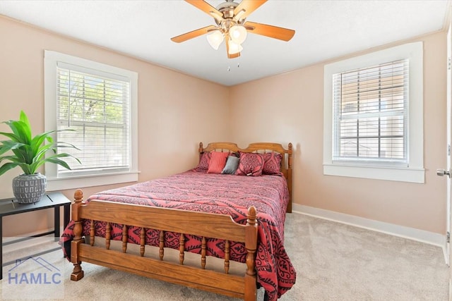 1514 Augusta Ave, Savannah, GA 31415 - carpeted bedroom featuring a ceiling fan, baseboards, and multiple windows