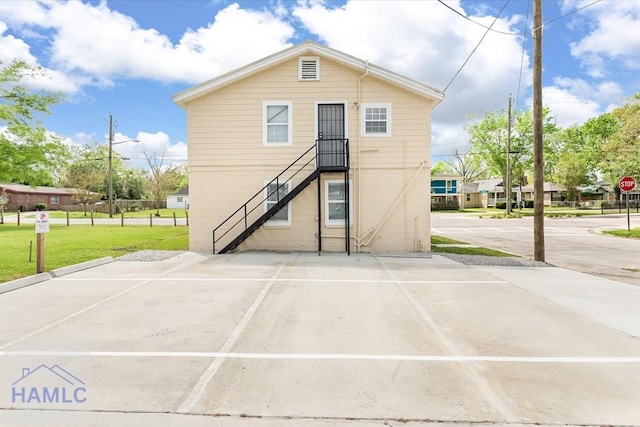 1514 Augusta Ave, Savannah, GA 31415 - rear view of house featuring a yard and stairway