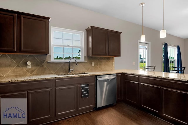 247 Morgan Field Blvd, Ludowici, GA 31316 - kitchen with stainless steel dishwasher, a sink, dark brown cabinets, and decorative backsplash