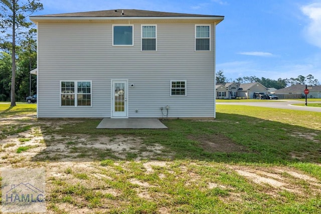 247 Morgan Field Blvd, Ludowici, GA 31316 - back of property with a patio and a yard