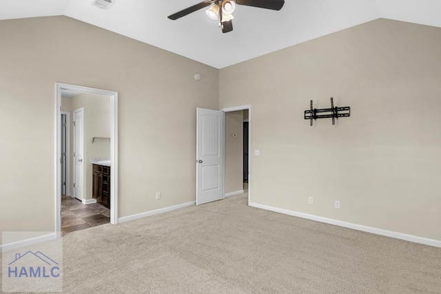 247 Morgan Field Blvd, Ludowici, GA 31316 - unfurnished bedroom with lofted ceiling, carpet floors, baseboards, a ceiling fan, and connected bathroom