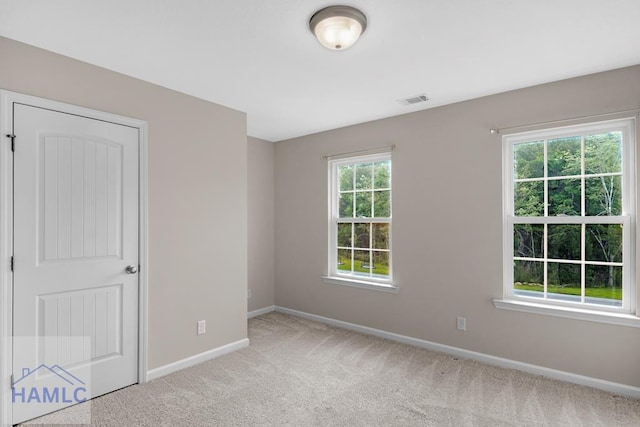 247 Morgan Field Blvd, Ludowici, GA 31316 - empty room with baseboards and light colored carpet