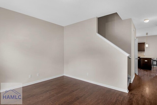 247 Morgan Field Blvd, Ludowici, GA 31316 - staircase featuring wood finished floors and baseboards