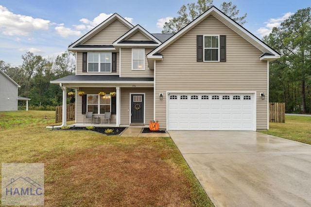 view of front facade featuring a porch, a garage, and a front lawn