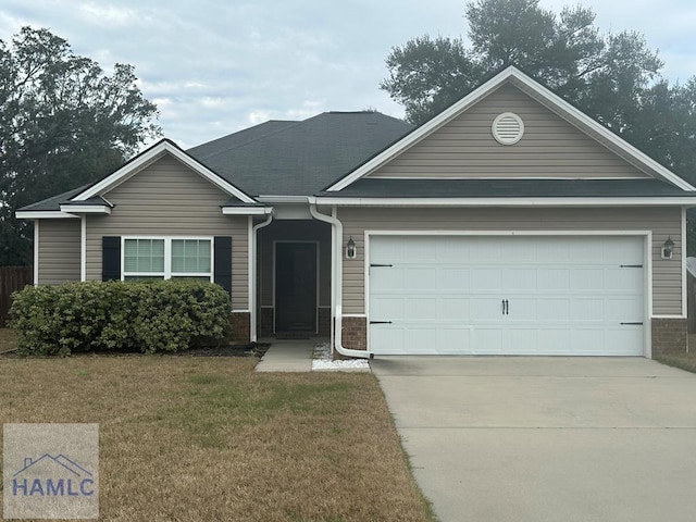 single story home with concrete driveway, an attached garage, and a front lawn