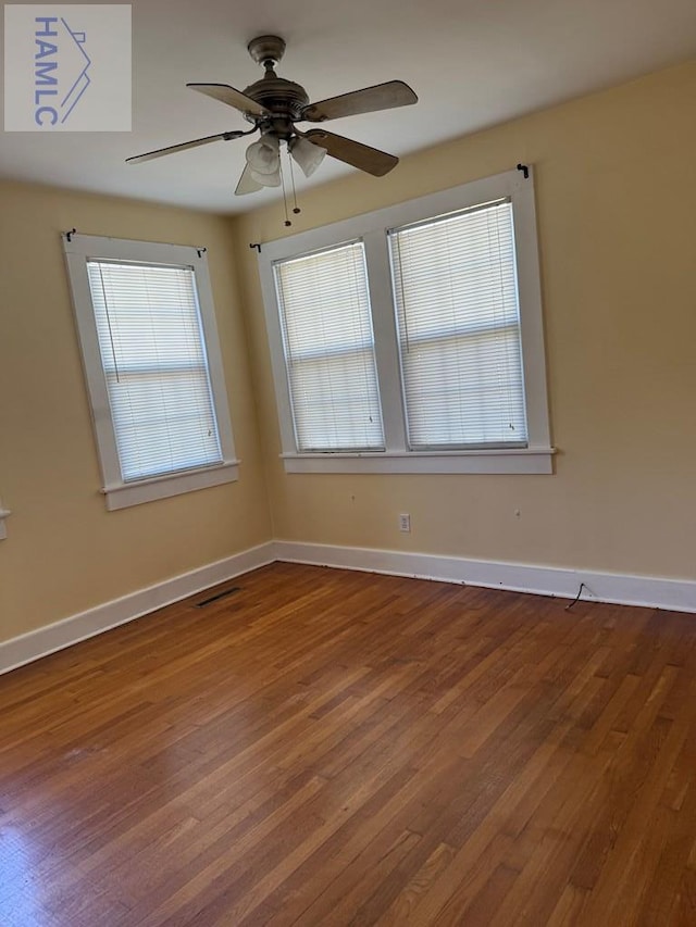 147 S Elm St, Jesup, GA 31545 - unfurnished room with wood finished floors and ceiling fan