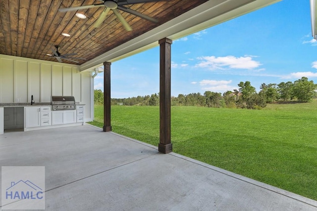 view of patio / terrace featuring an outdoor kitchen, grilling area, a sink, and ceiling fan