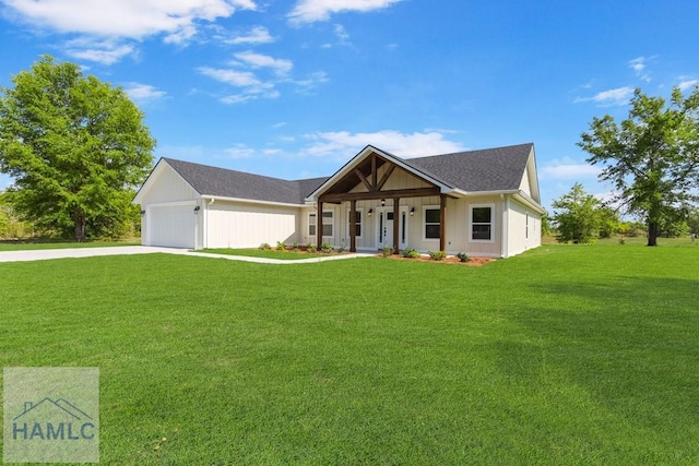 modern inspired farmhouse with concrete driveway, a front lawn, an attached garage, a porch, and roof with shingles