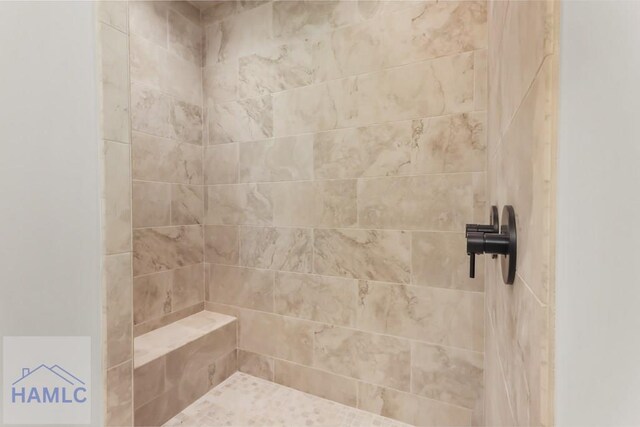 full bathroom featuring a tile shower