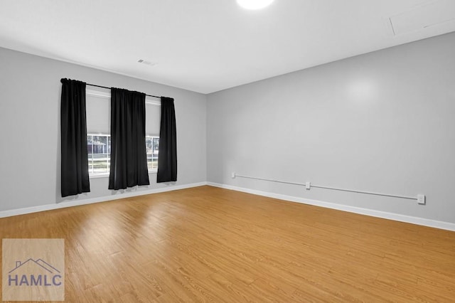 spare room featuring hardwood / wood-style floors