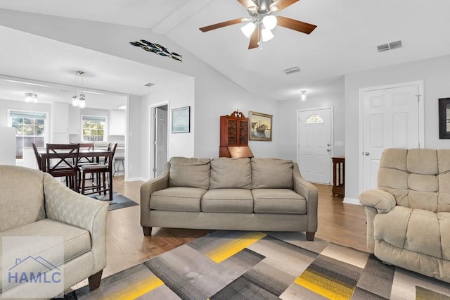 living room featuring ceiling fan, lofted ceiling with beams, and dark hardwood / wood-style floors