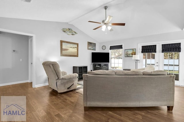 living room with french doors, dark hardwood / wood-style floors, vaulted ceiling, and ceiling fan