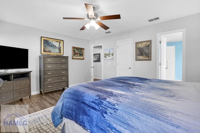 bedroom featuring ceiling fan and dark wood-type flooring