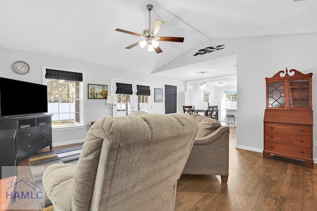 living room with vaulted ceiling with beams, ceiling fan, and dark wood-type flooring