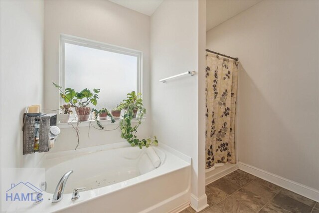 91 Thomas Way SE, Ludowici, GA 31316 - full bath with a stall shower and a garden tub