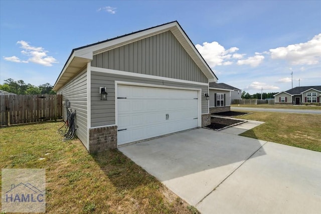 91 Thomas Way SE, Ludowici, GA 31316 - view of property exterior featuring board and batten siding and concrete driveway