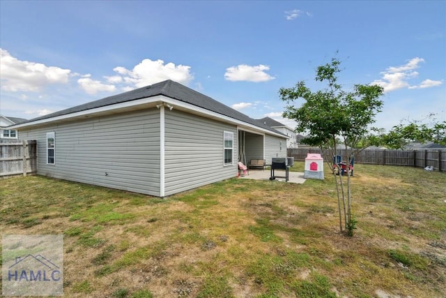 91 Thomas Way SE, Ludowici, GA 31316 - back of house featuring a fenced backyard and a patio