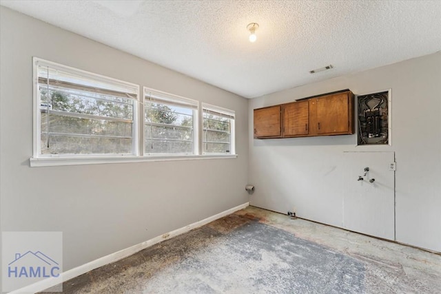 interior space with a textured ceiling