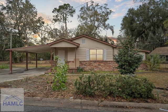 view of front of home with a carport