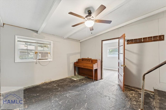 misc room with ceiling fan, cooling unit, and beamed ceiling