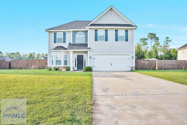 view of property with a front yard and a garage