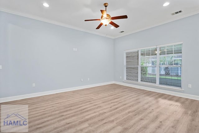 unfurnished room with visible vents, light wood-style floors, crown molding, baseboards, and ceiling fan