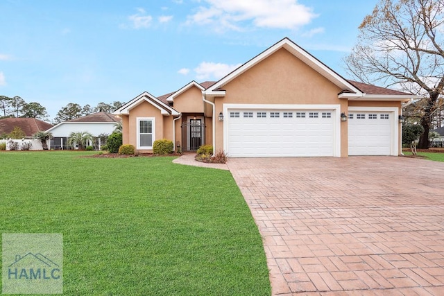 single story home featuring stucco siding, an attached garage, decorative driveway, and a front lawn