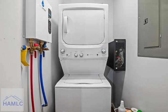 206 W Jones Ave, Statesboro, GA 30458 - washroom with estacked washer and dryer, water heater, and electric panel