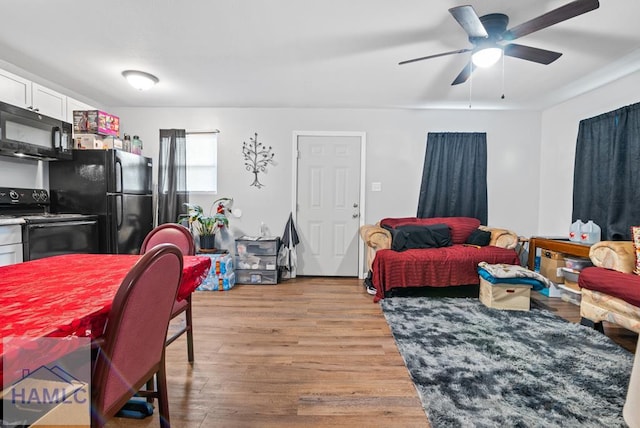 206 W Jones Ave, Statesboro, GA 30458 - living room featuring a ceiling fan and light wood-type flooring
