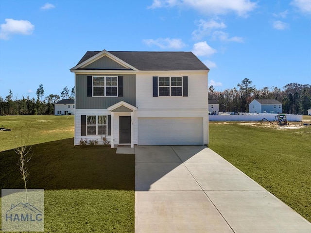 traditional-style house with concrete driveway, a front lawn, and an attached garage