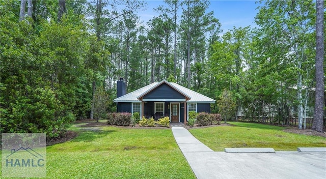 152 Covey Rise Pl, Midway, GA 31320 - view of front of house with a chimney and a front lawn