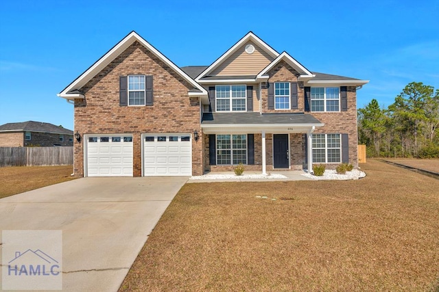 view of front of property with fence, a front lawn, concrete driveway, and brick siding