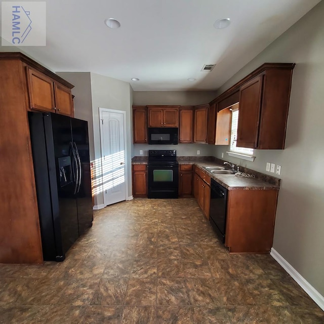 kitchen with sink and black appliances