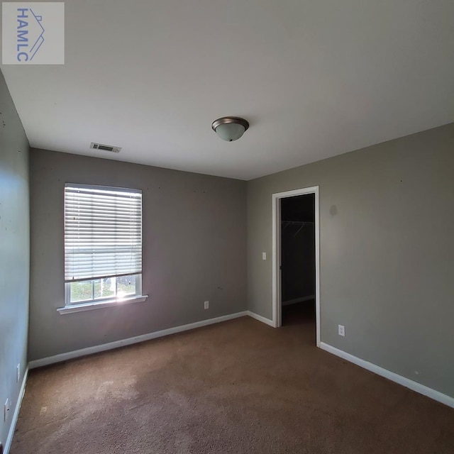 spare room featuring carpet floors