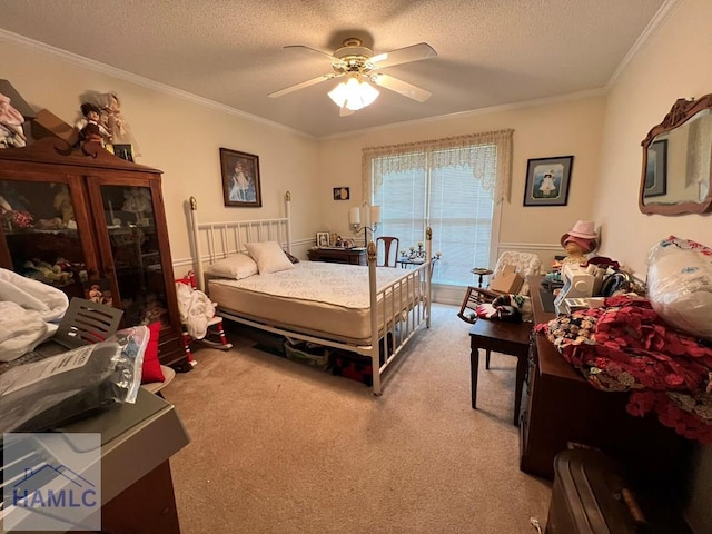 carpeted bedroom with ceiling fan, crown molding, and a textured ceiling