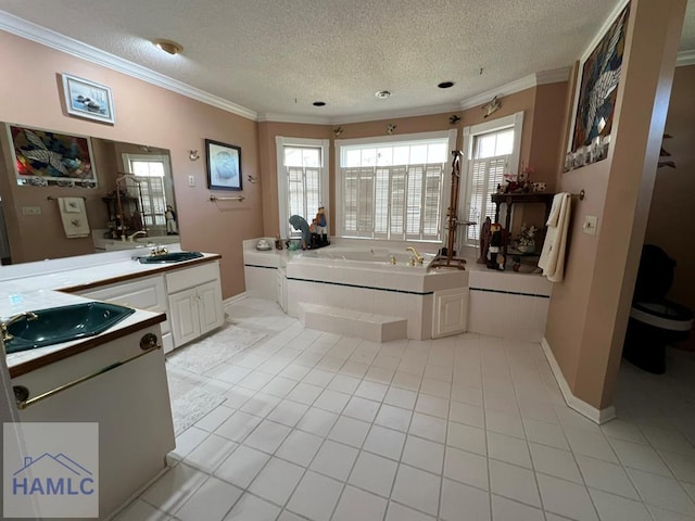 bathroom with tile patterned flooring, vanity, a textured ceiling, and ornamental molding